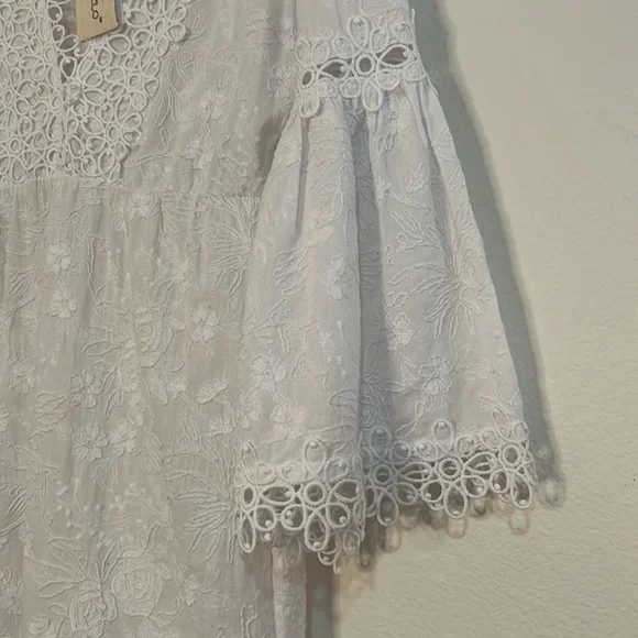 Rafaela D’Angelo. White boho or beach maxi dress.